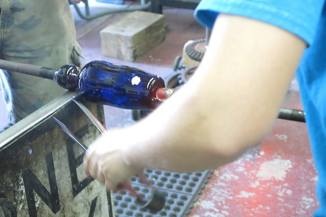 Removing a pole to create the open top of the glass.