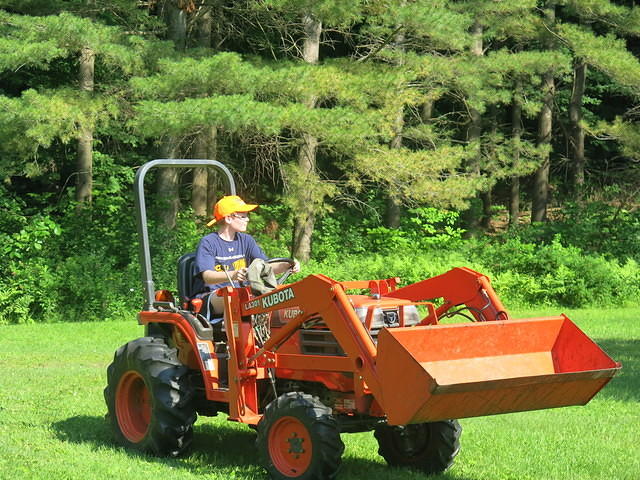 Nathan driving the Kubota in the circle