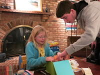 Flint helps inspect a present