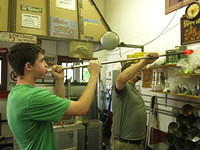 Flint blows his glass blob for the first step of his glass bowl project