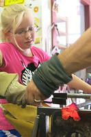 Here she is forming the interior flower-type decoration. This glass is also blue but appears here as red hot