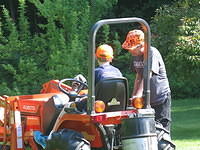 Dad teaching Nathan how to drive the Kubota